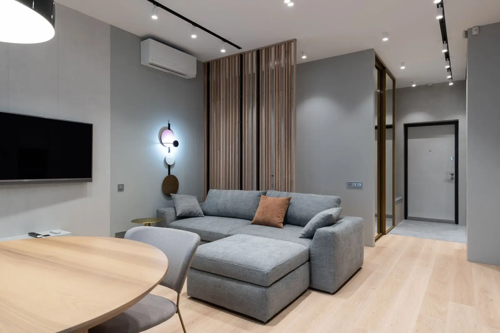 Light oak living room with a grey sectional sofa